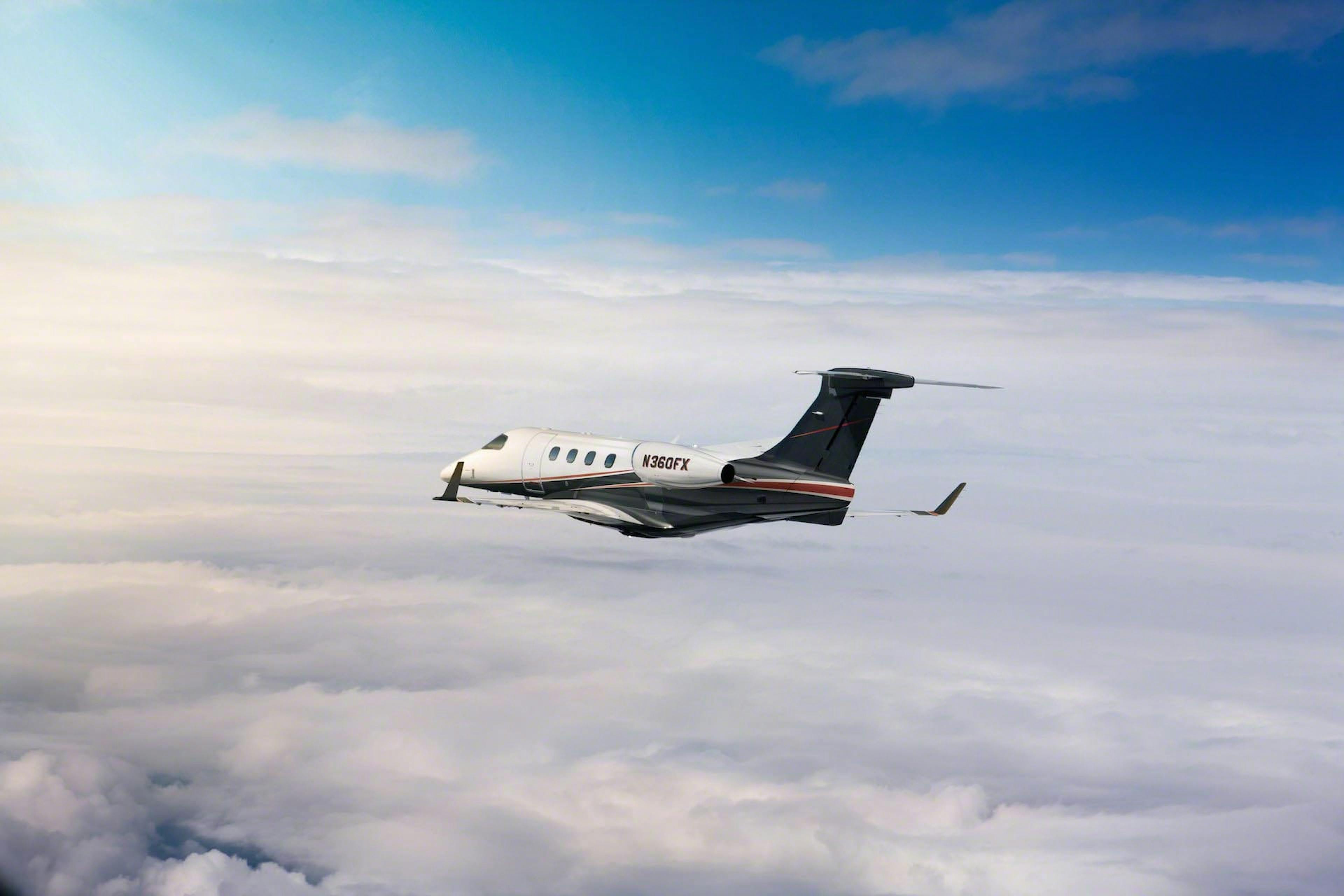 Phenom 300 Flying Through Clouds