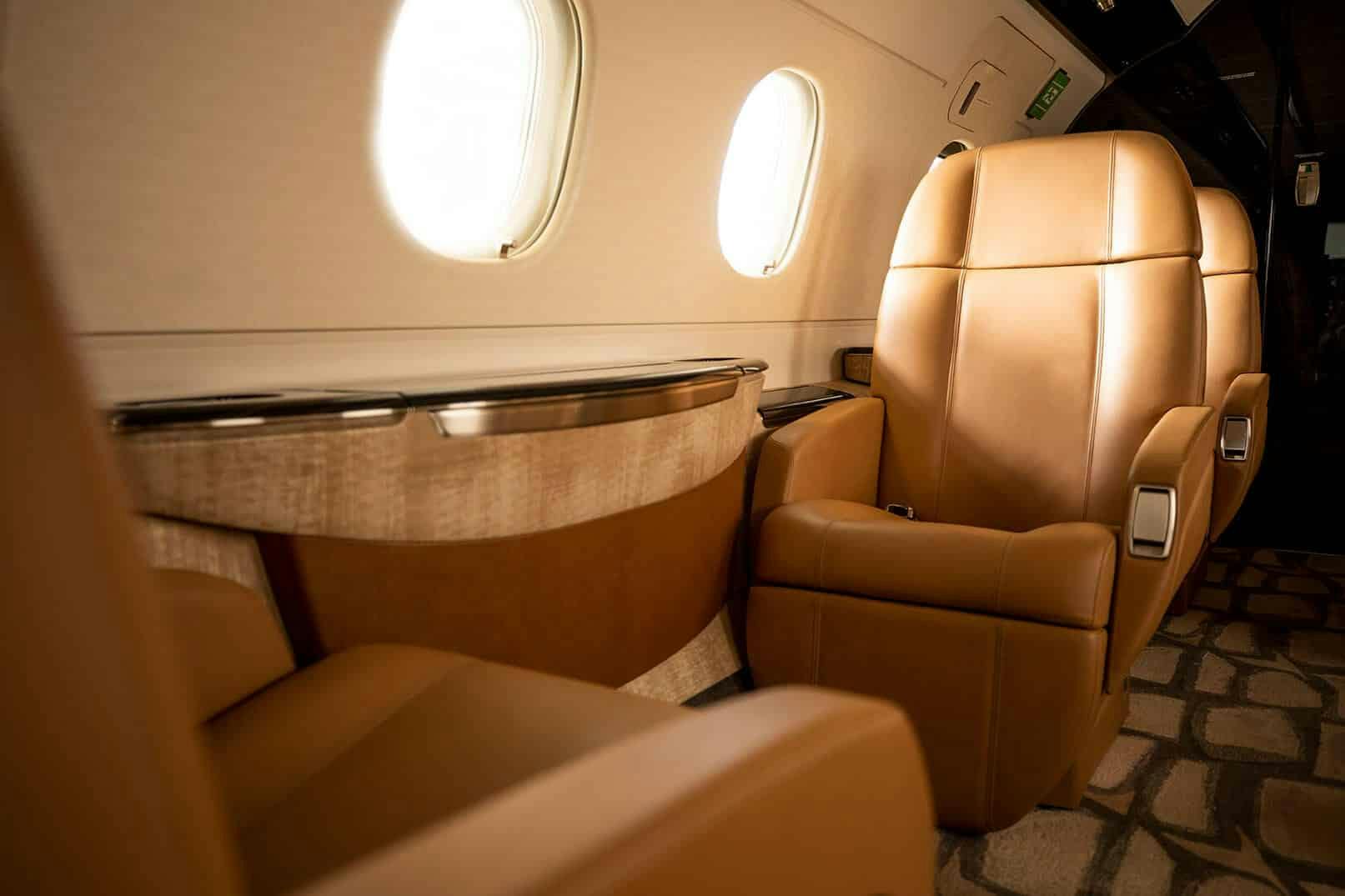 Flexjet, private jet, Legacy 450, jet interior, midsize, super midsize, mid cabin, Dakota, Embraer, LXi Cabin Collection, seats, leather seating, captains chairs
