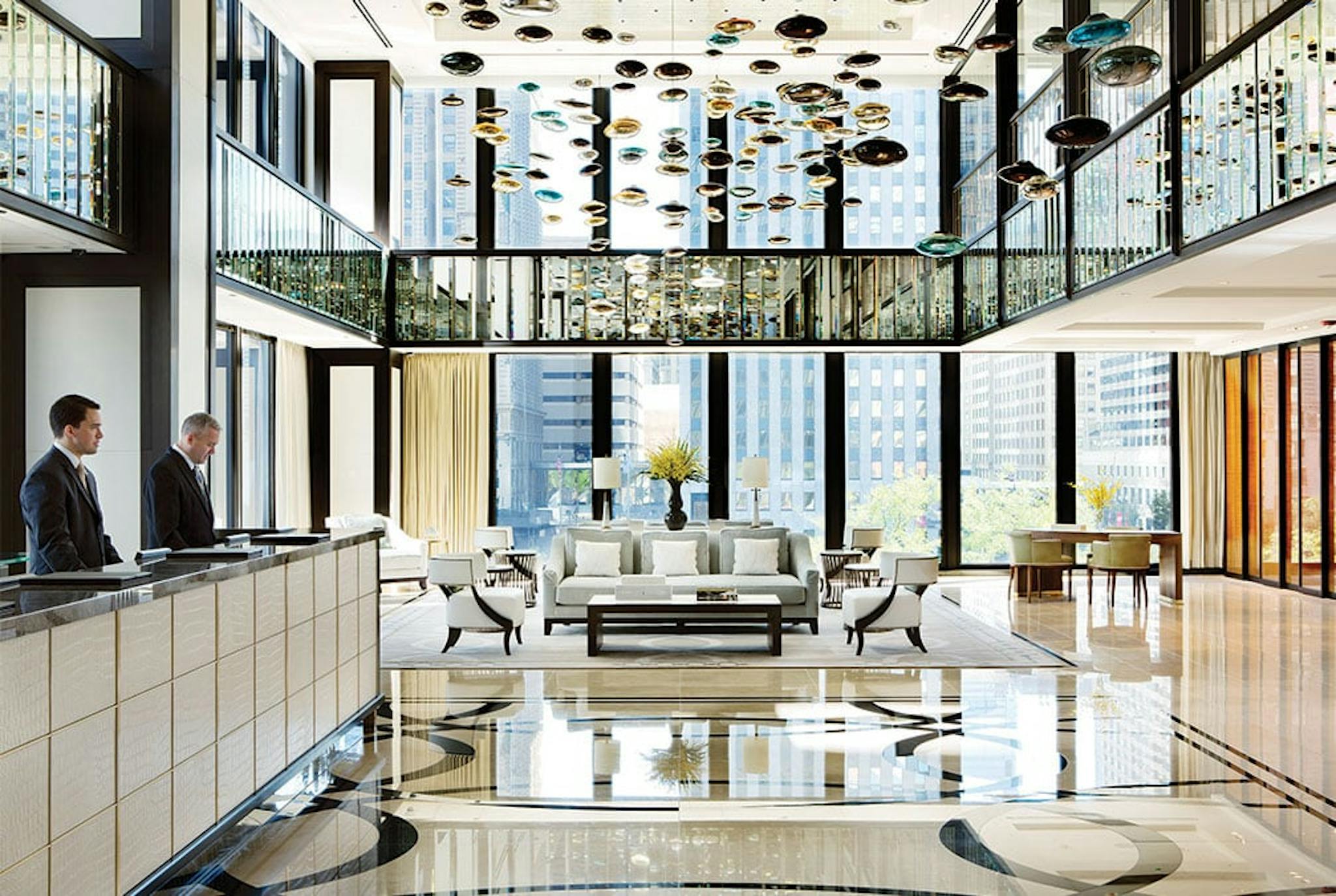 Langham lobby with shiny floors and ornate decorations