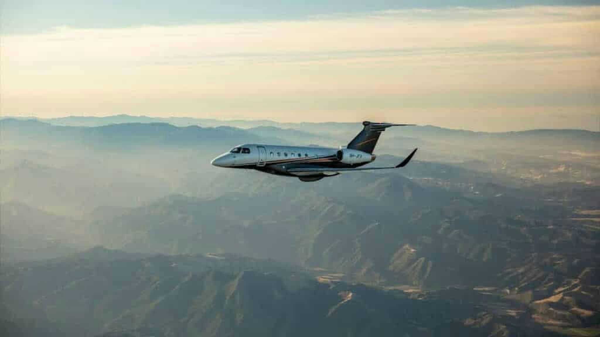 aircraft flying over mountains