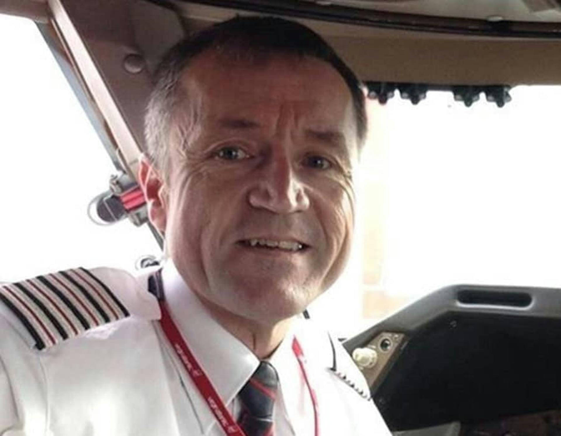 Clive Richardson in the cockpit wearing the pilots uniform