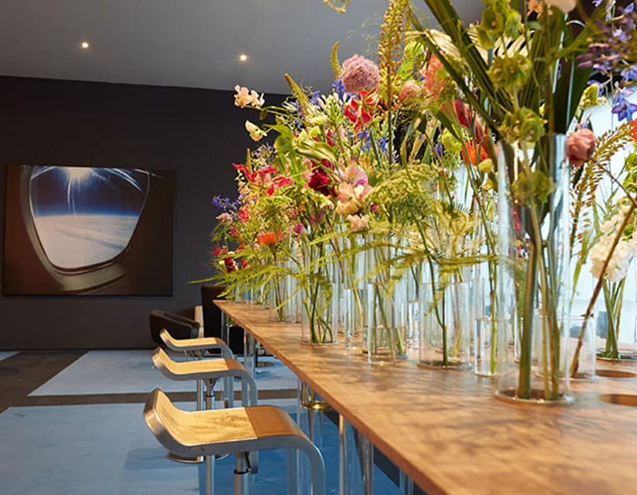 flowers arranged on a long table