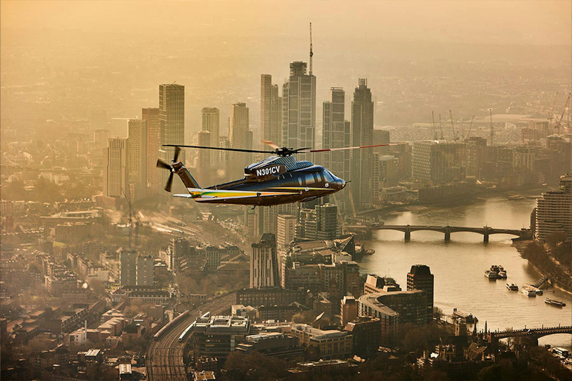 s76 flying in a city