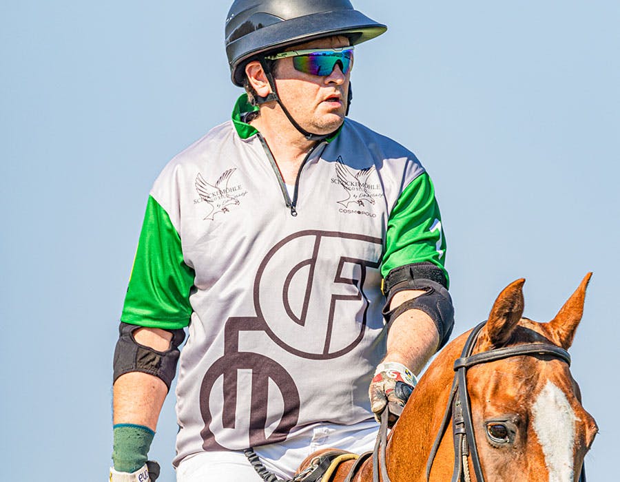 Daniel Deistler on a horse in polo uniform