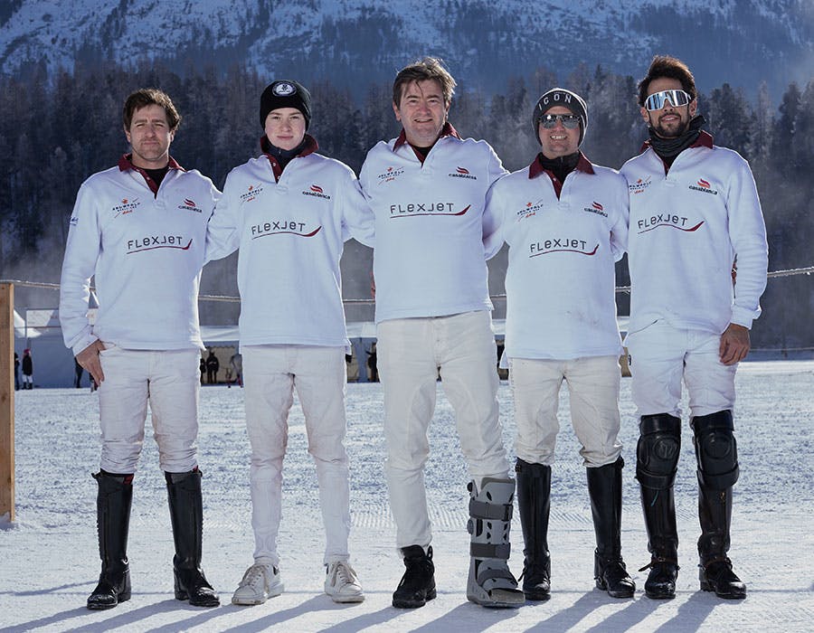 snow polo team posing for a photo
