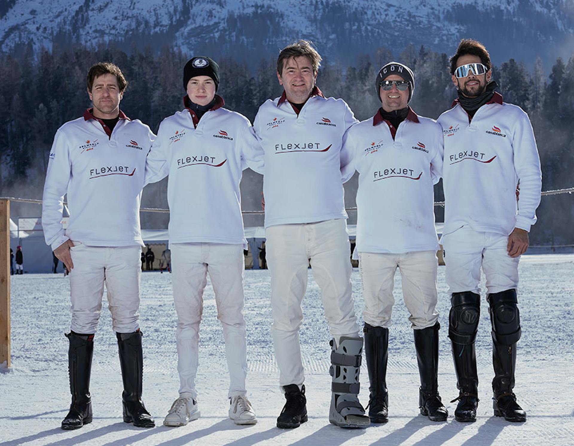 snow polo team posing for a photo