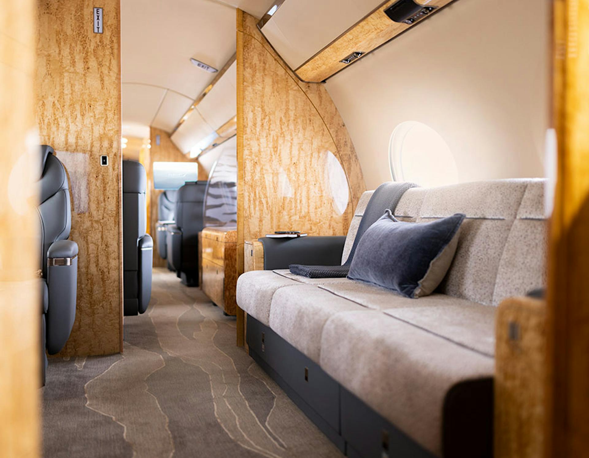 interior of a private jet, specifically the sofa area
