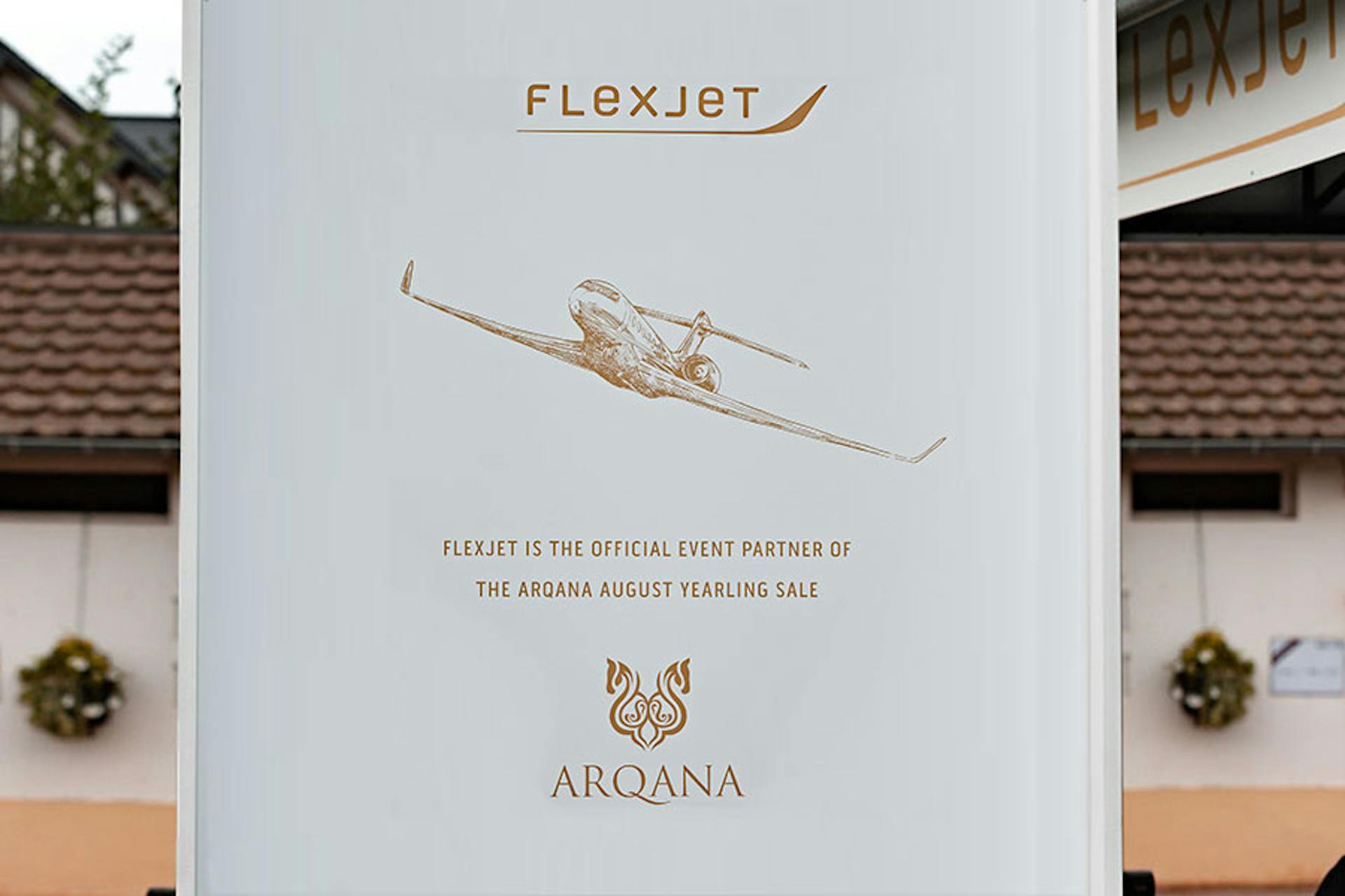 Sign for Flexjet in white and orangish gold