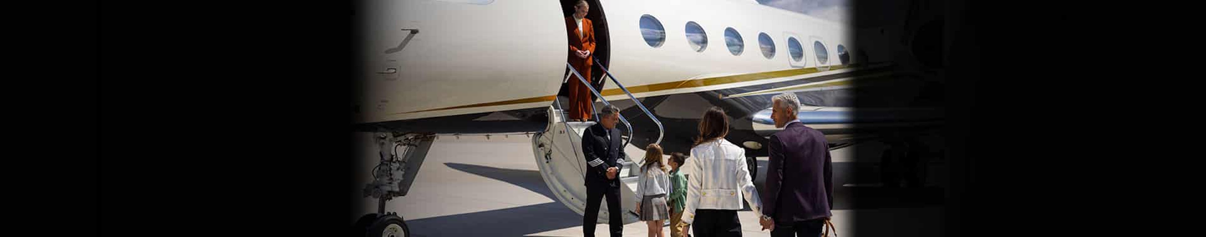 a family getting on board the private jet