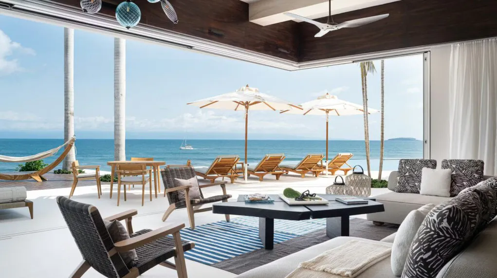 View from a luxury rental home one the beach with lots of furniture for relaxation