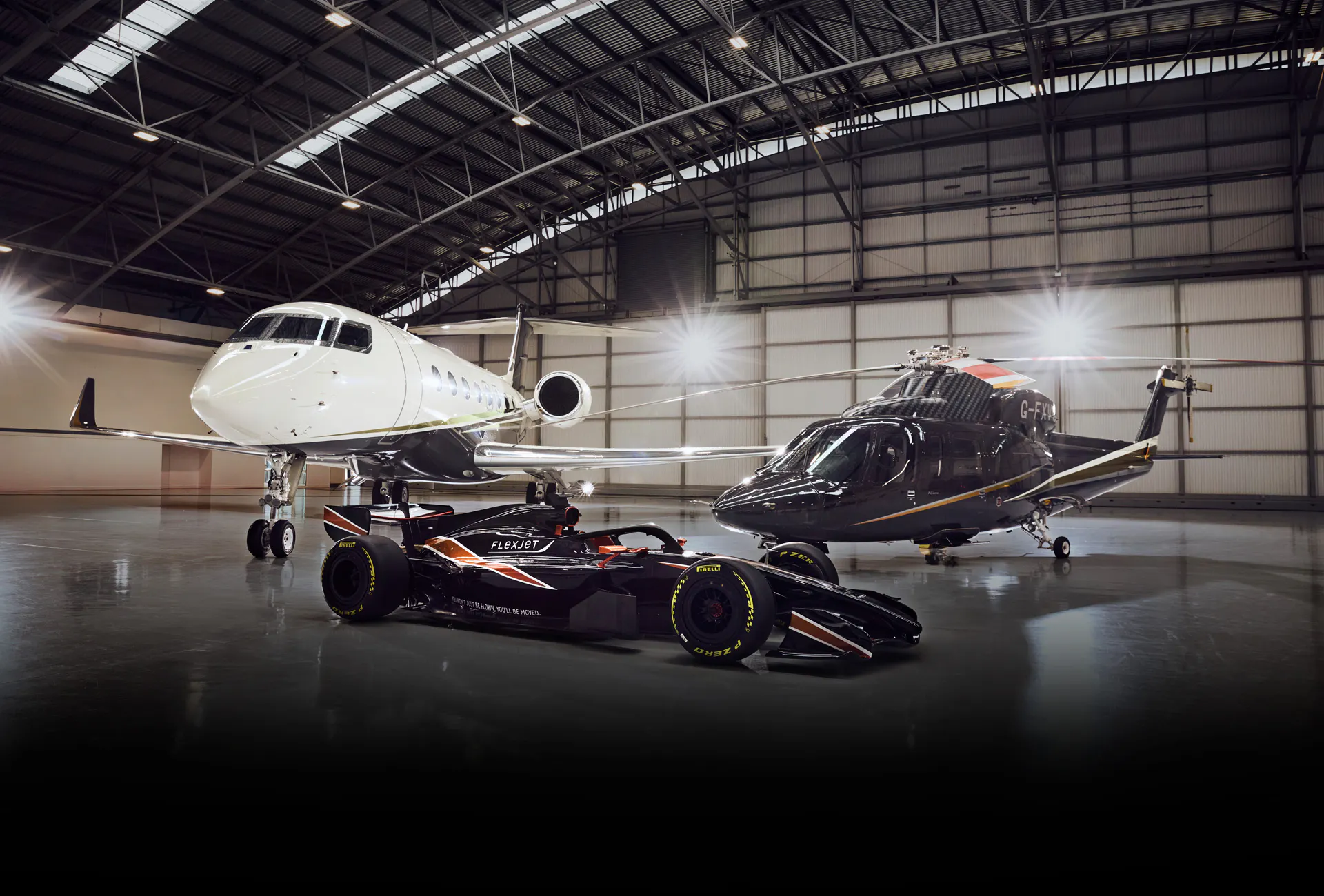 A Flexjet Hangar with a private jet, a helicopter and a FlexJet branded F1 car.