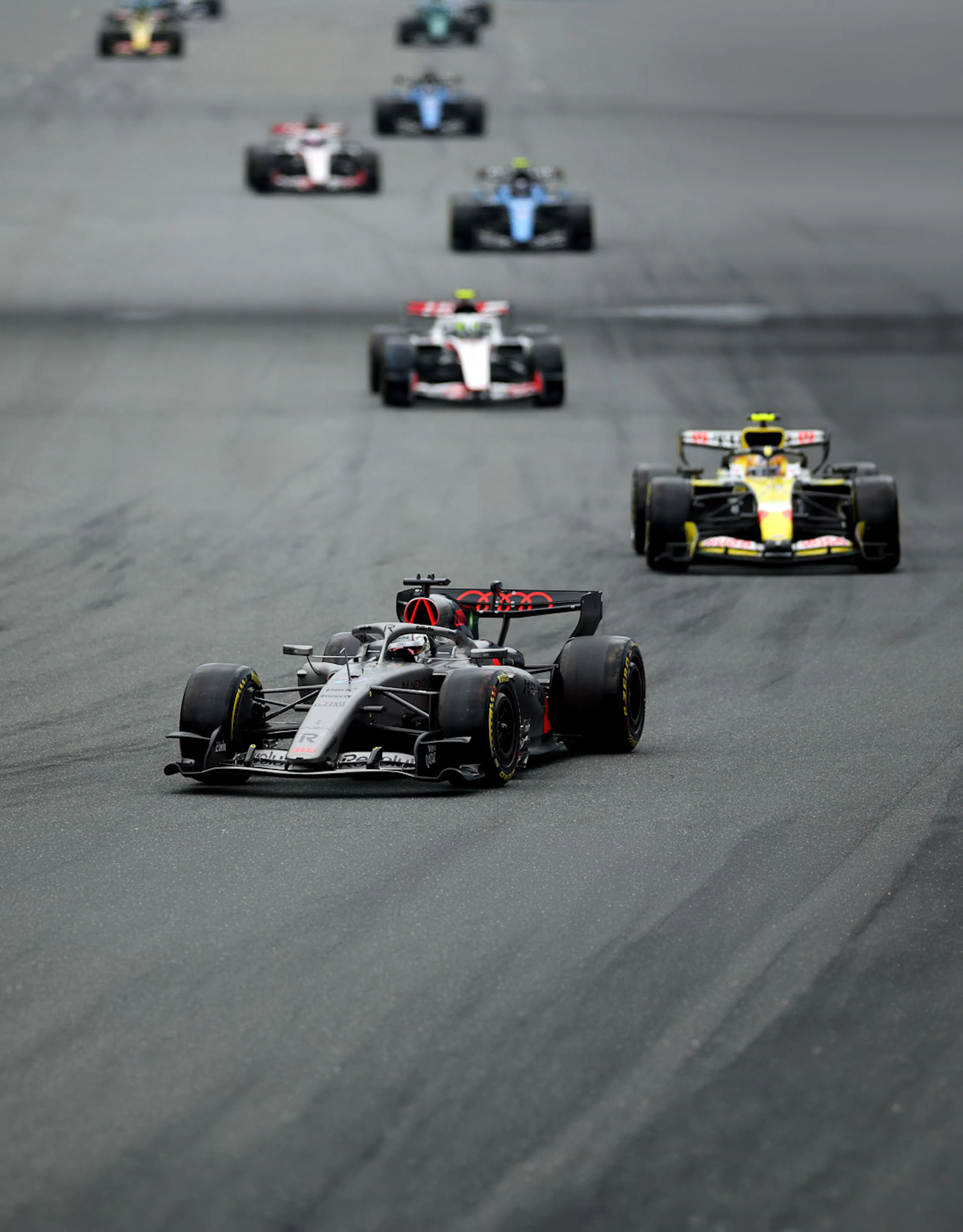 Some F1 cars on a track