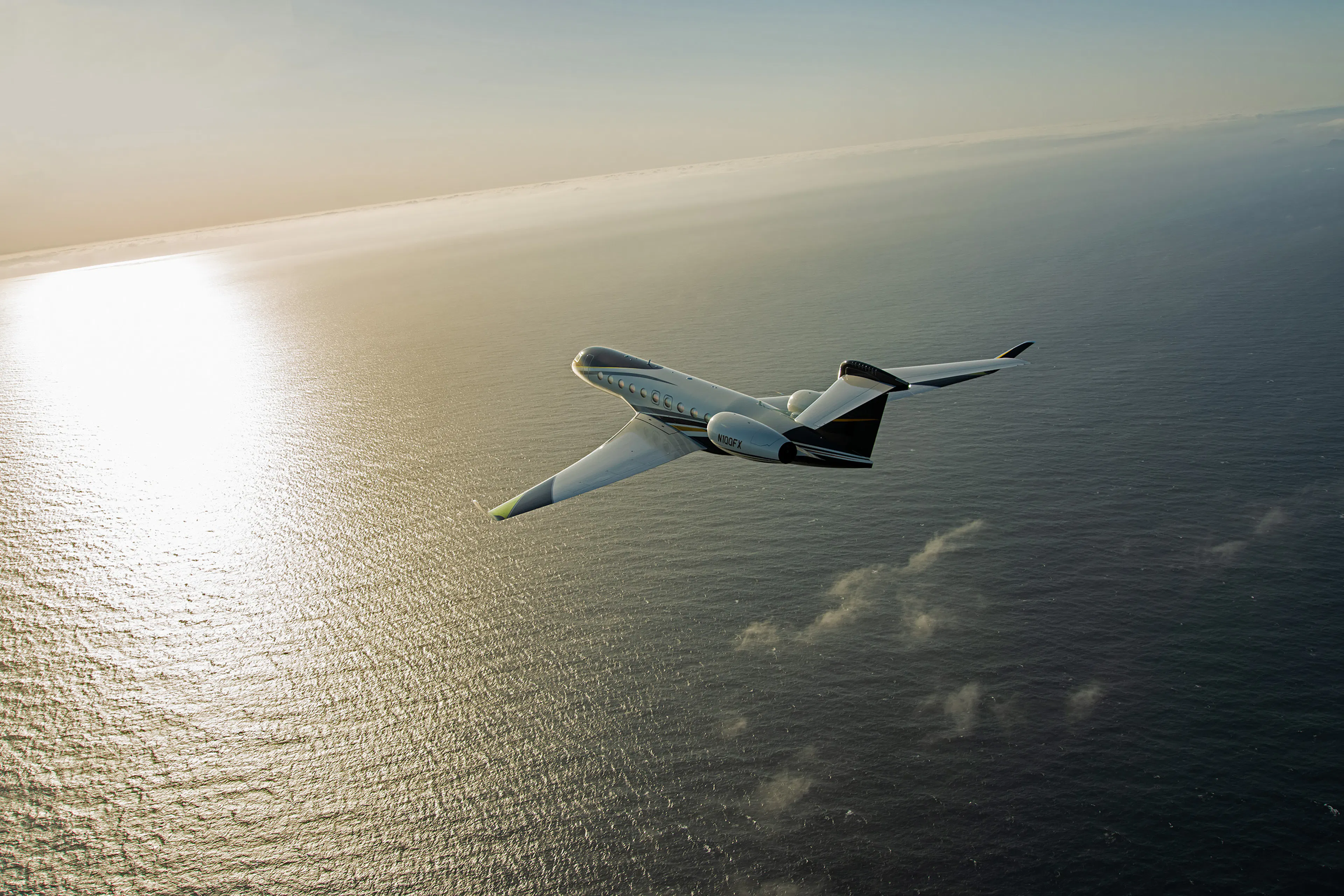 G700 Flying into the sunset over the ocean