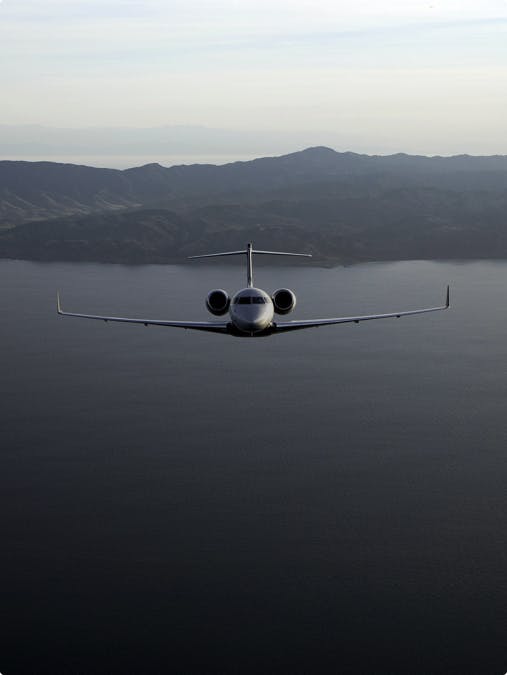 challenger 300 flying over water