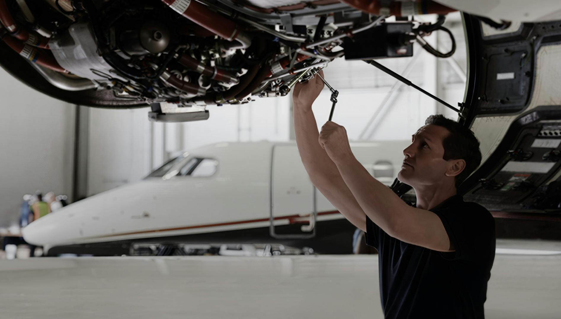 Mechanic working on engine
