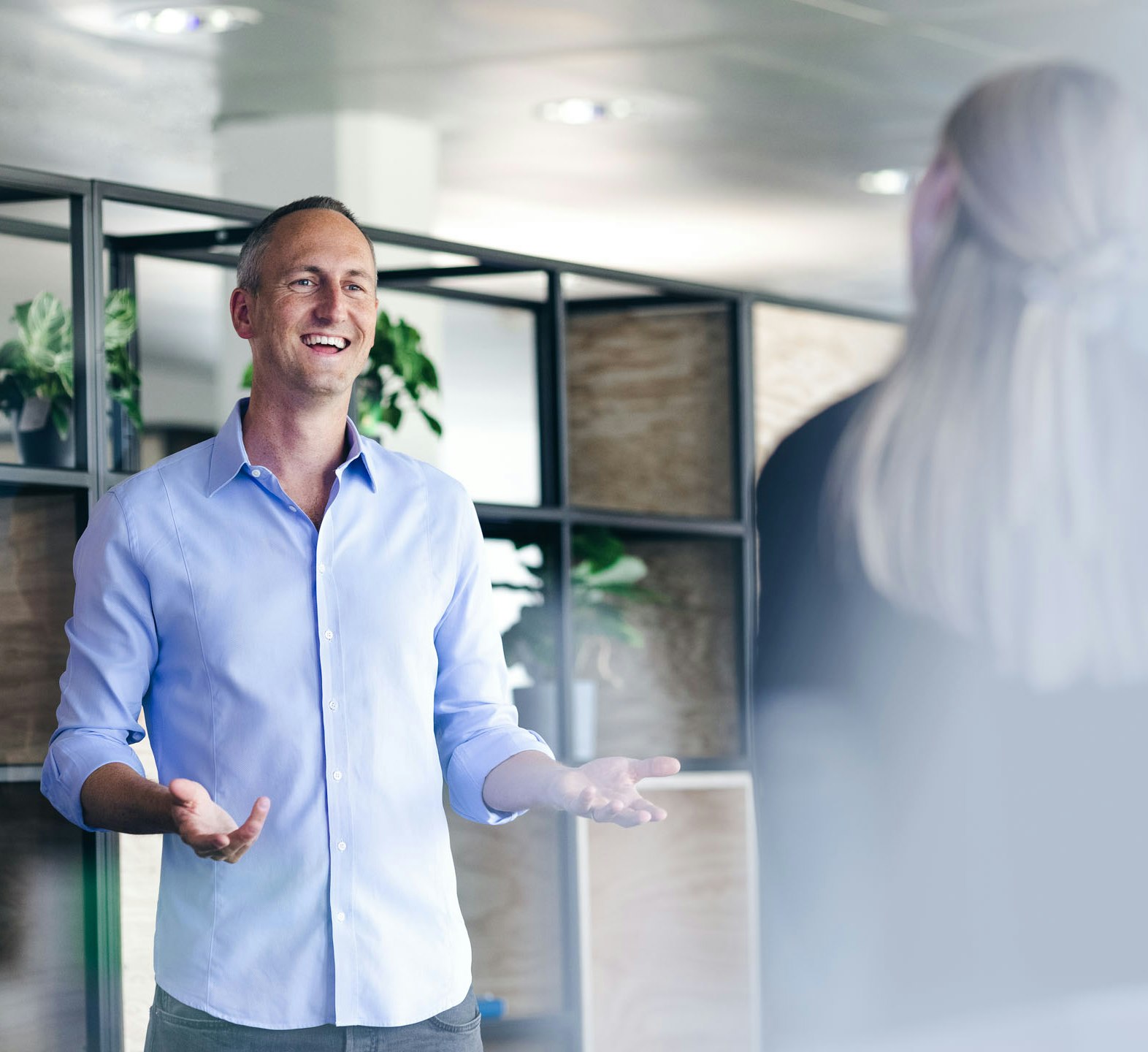 Man in a shirt talking to a woman