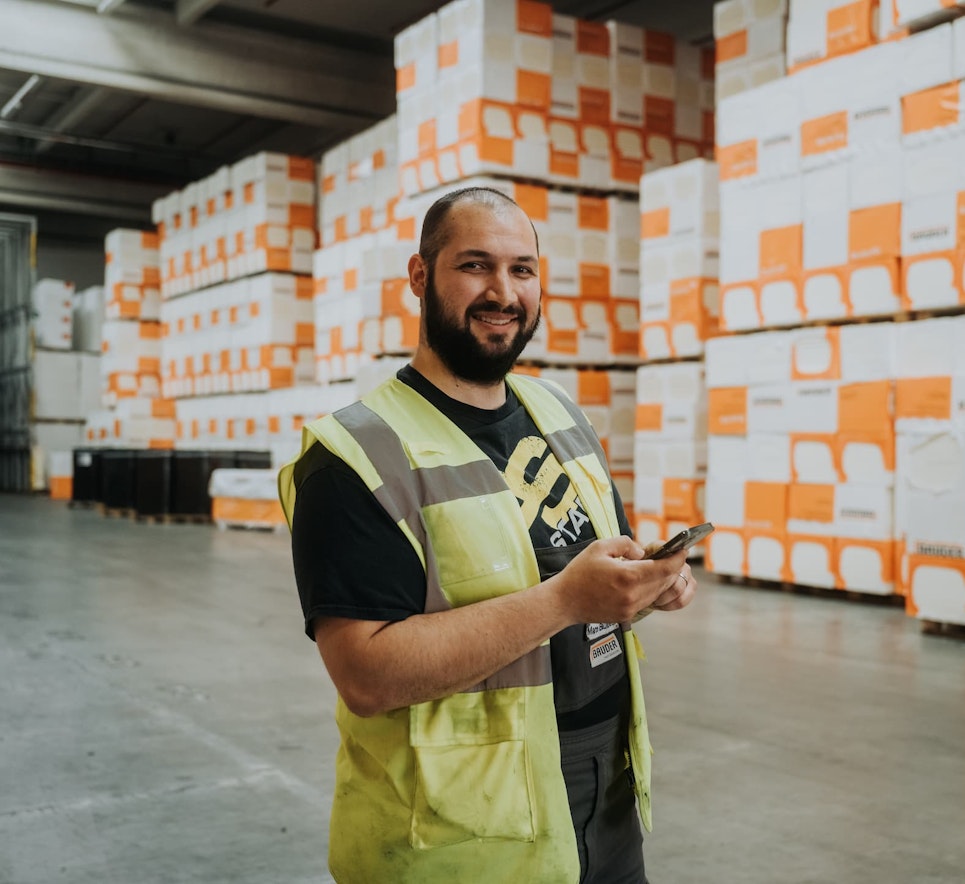 Employee in a warehouse using the app