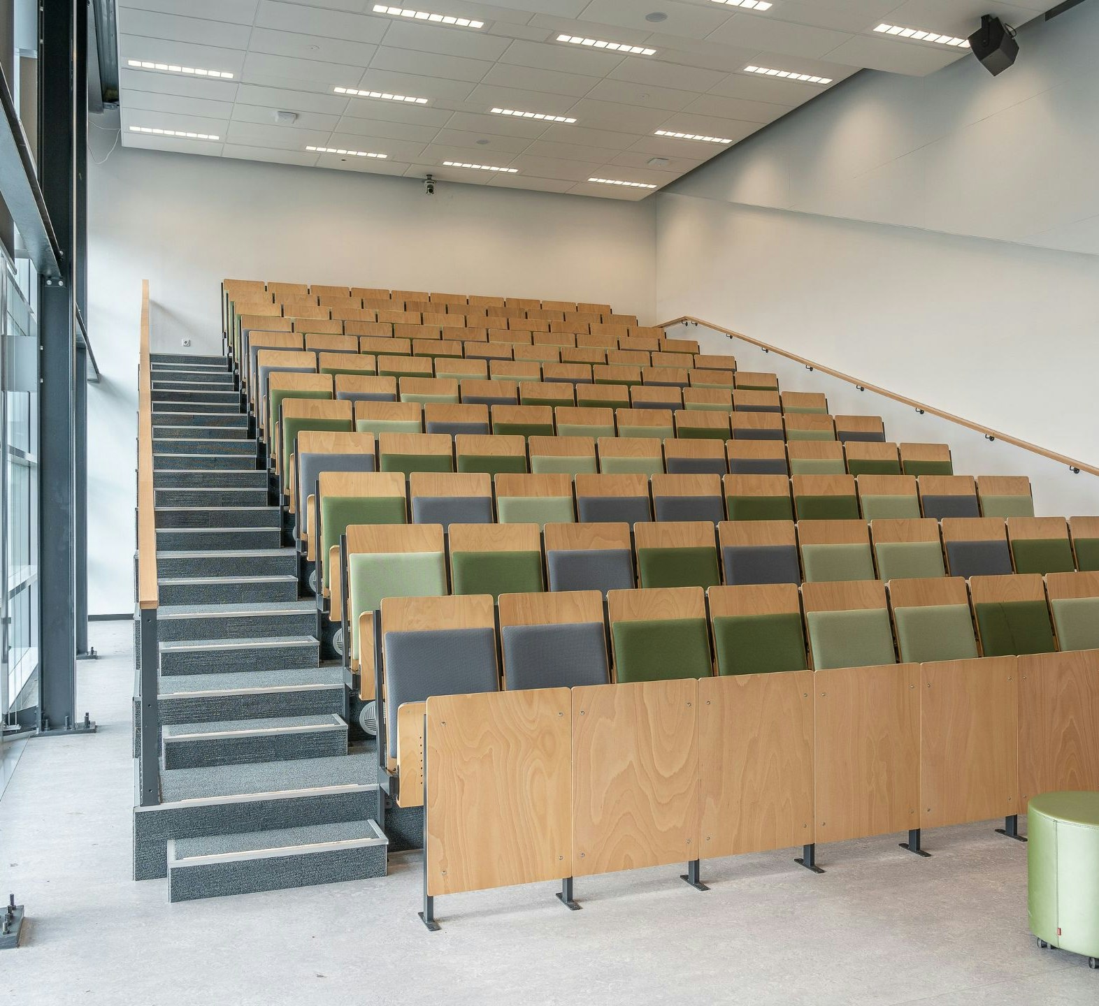 Step hall in a university with wooden seats