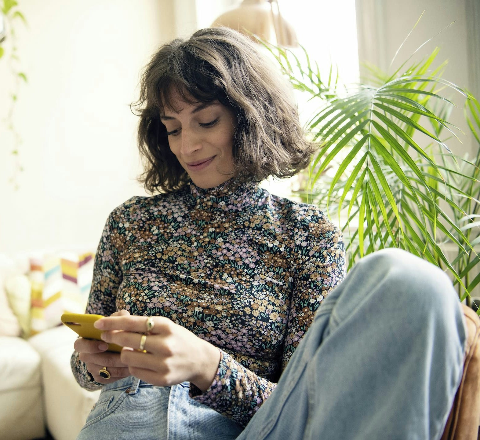 woman using smartphone and smiling