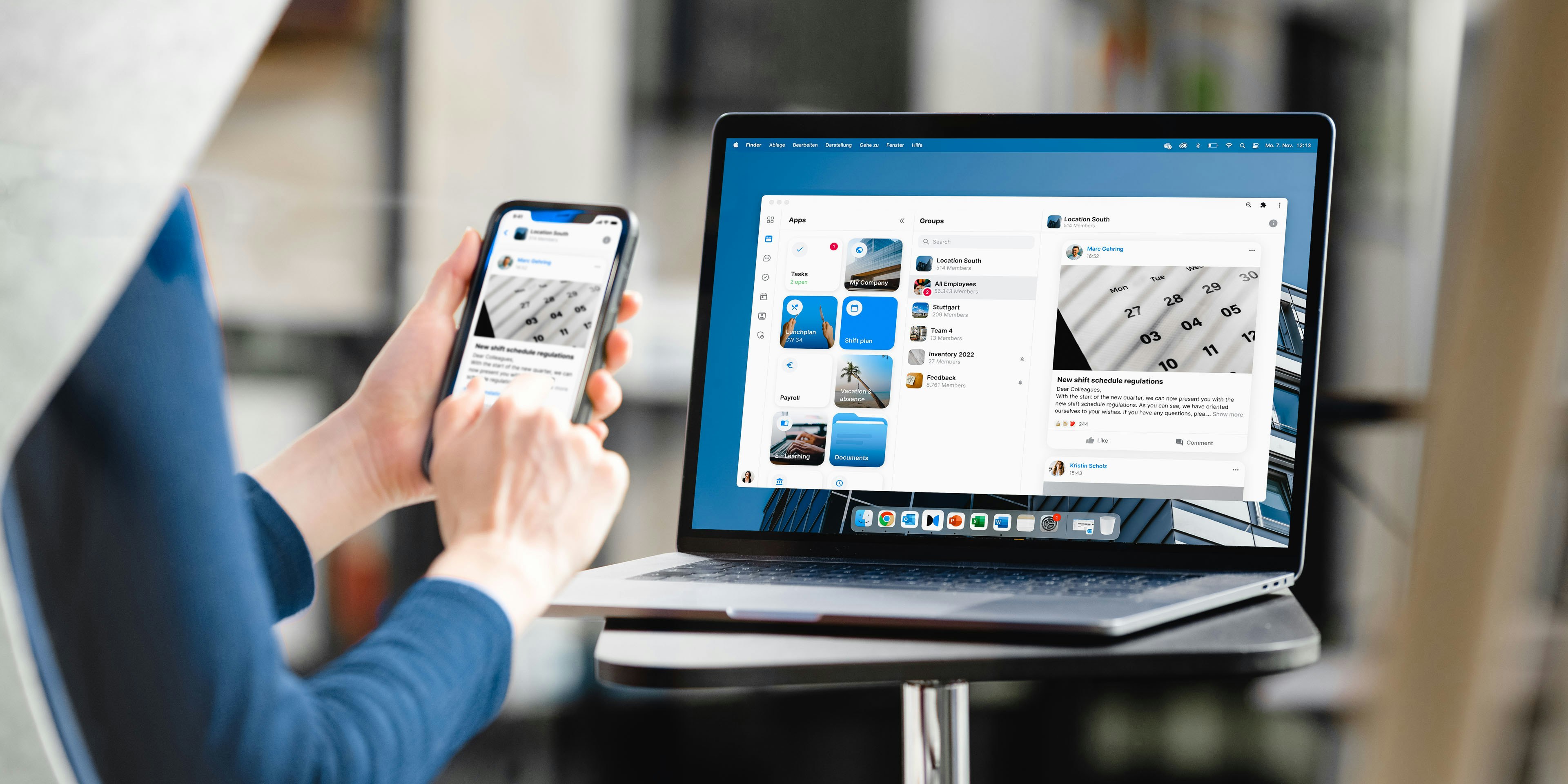 Person sitting on chair, on table laptop with mockup and mobile phone in hand