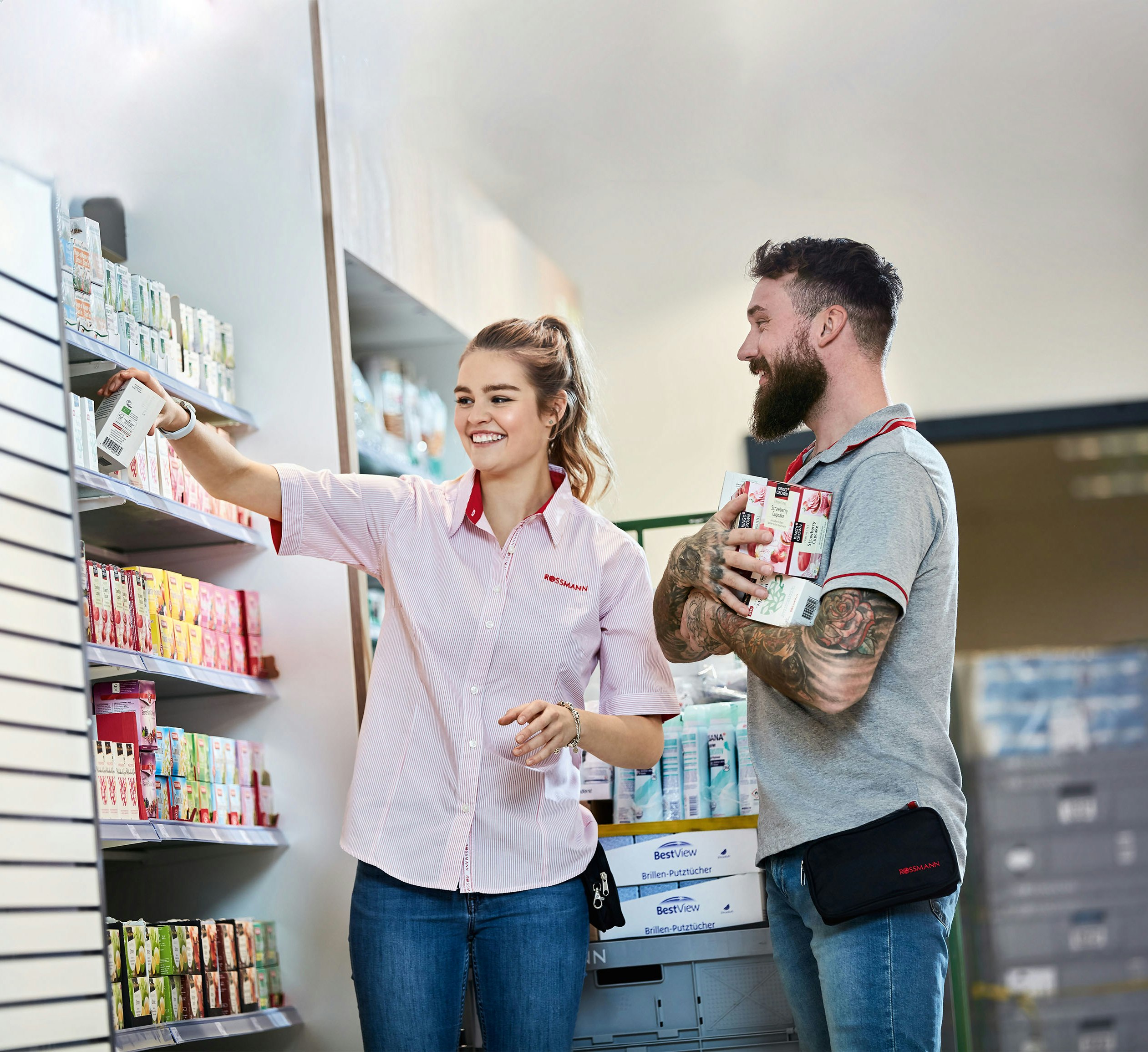 Rossmann employees smiling while working