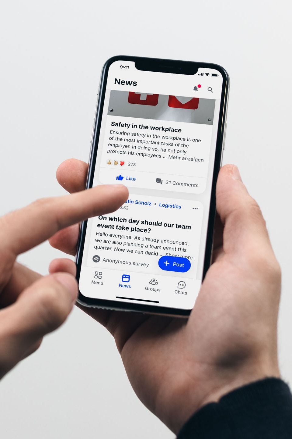 Person scrolls through the newsfeed on the smartphone