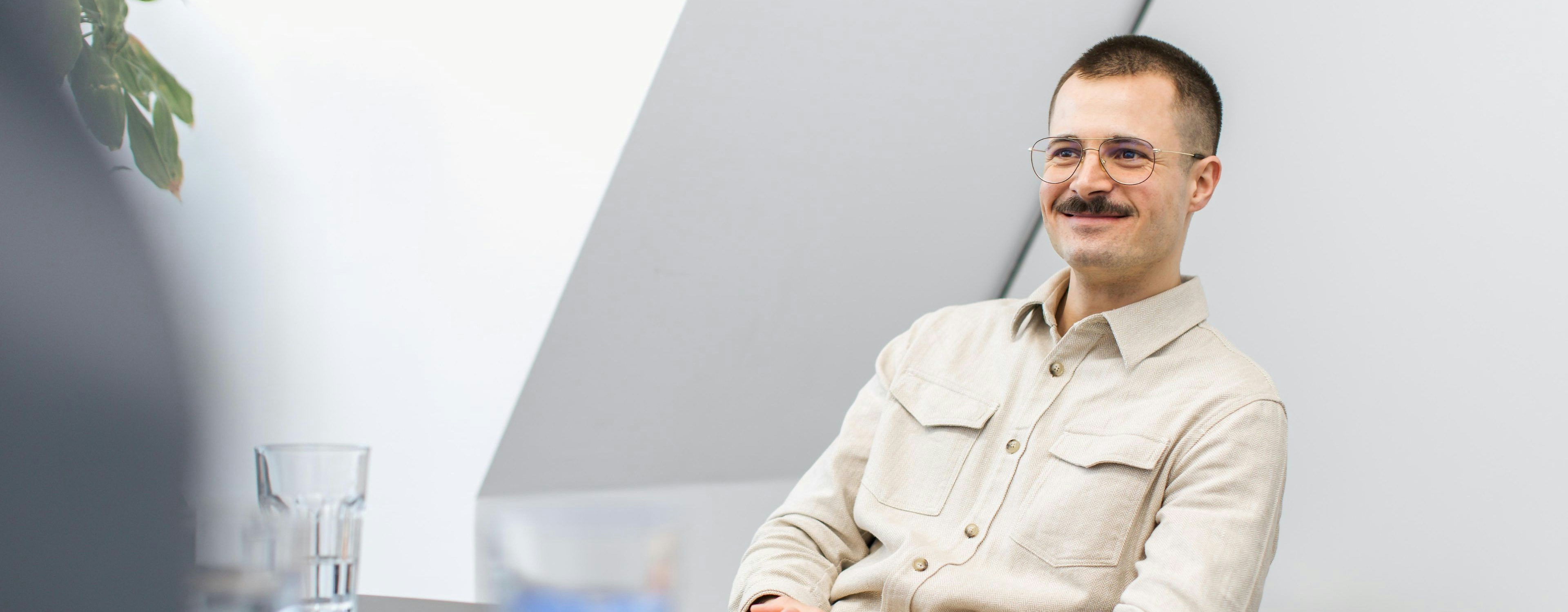 Daniel Schädle from GLS wears a light-coloured shirt and a moustache