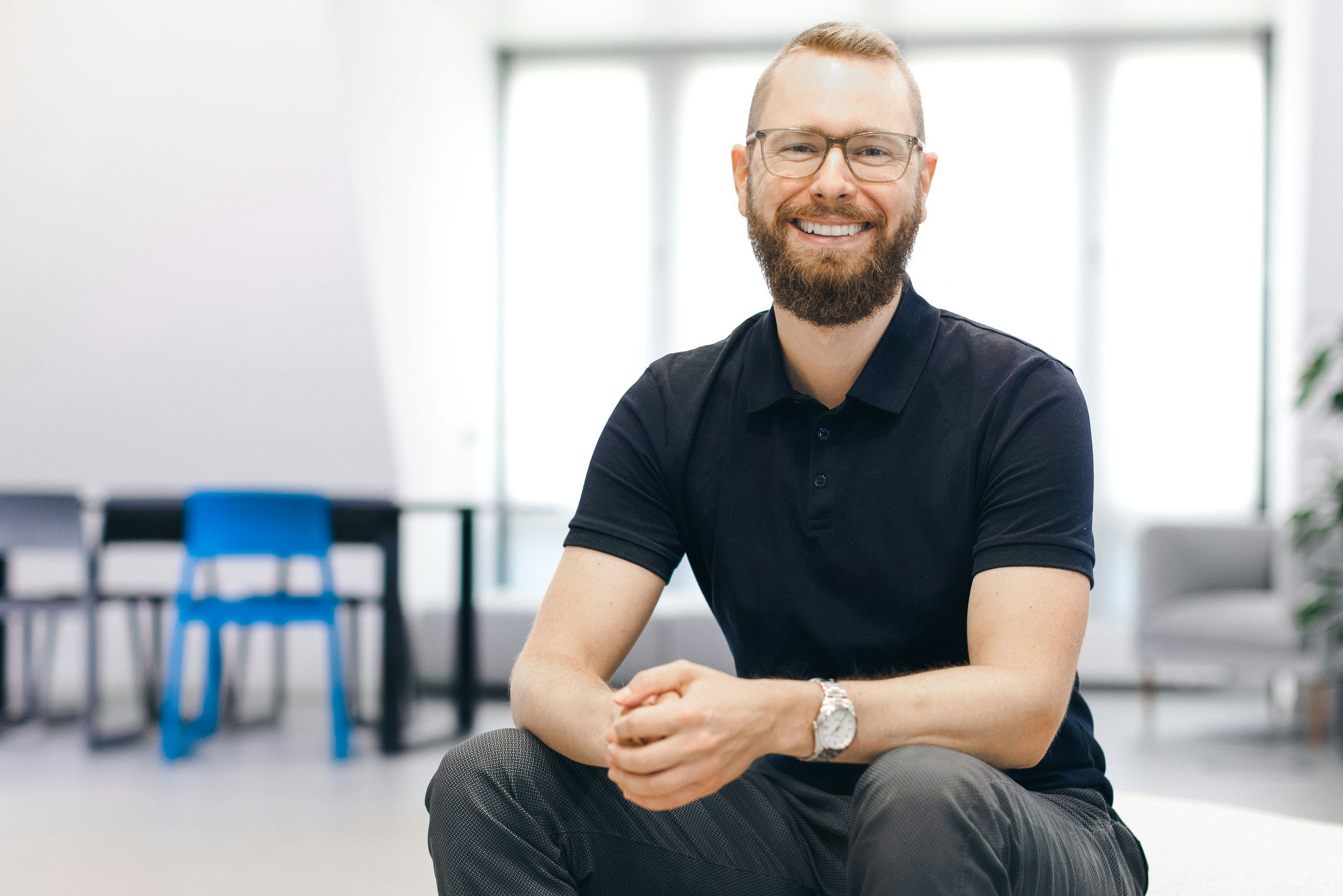 Giacomo Kenner sits smiling in the Flip office