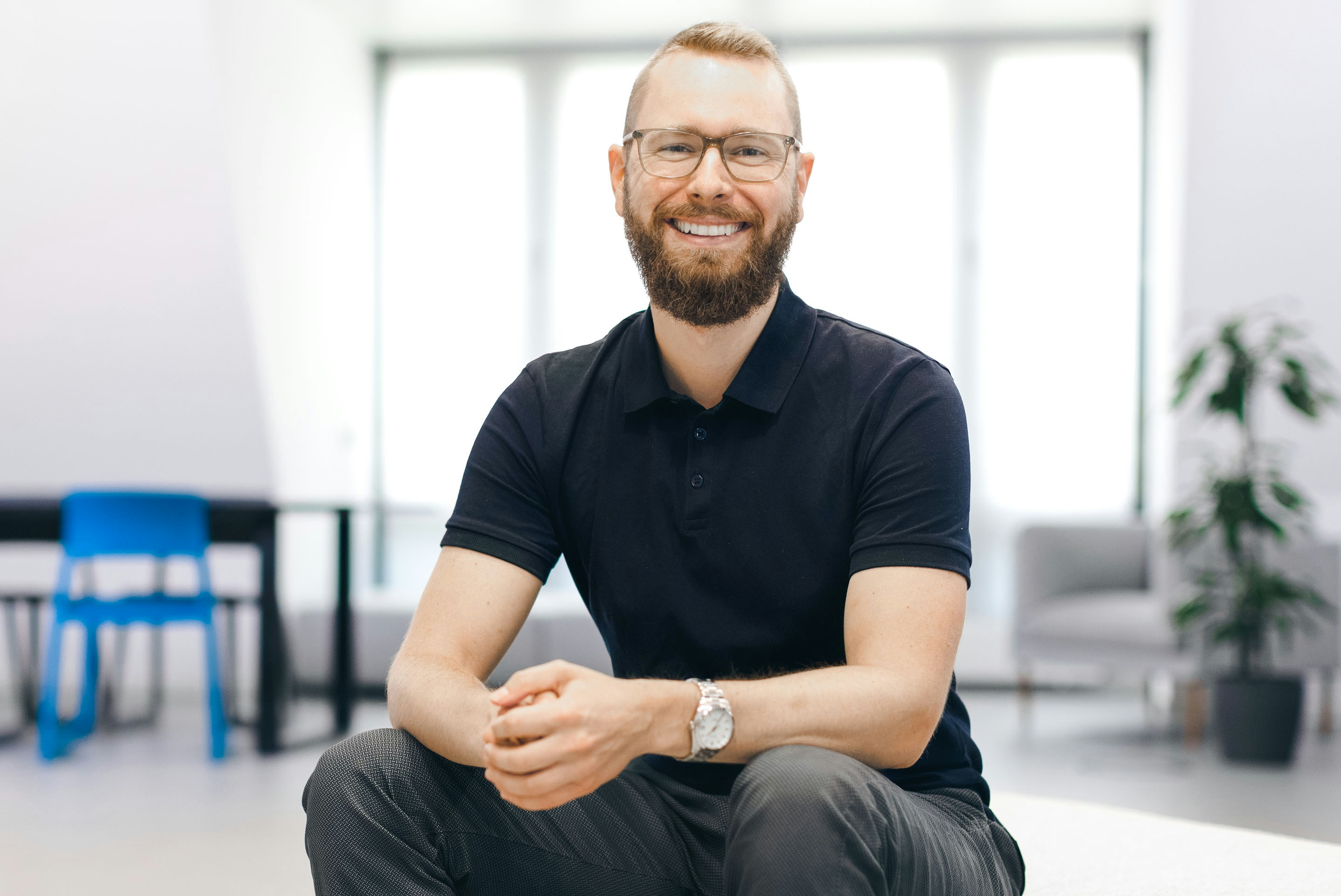 Giacomo Kenner sits smiling in the Flip office