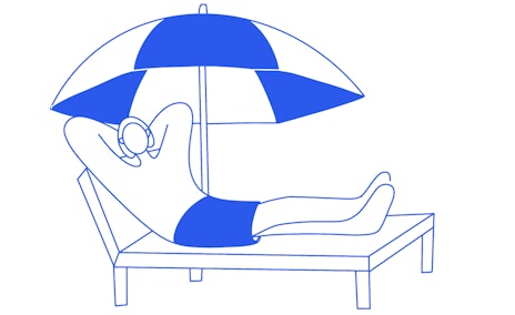 Person on lounger under sunshade