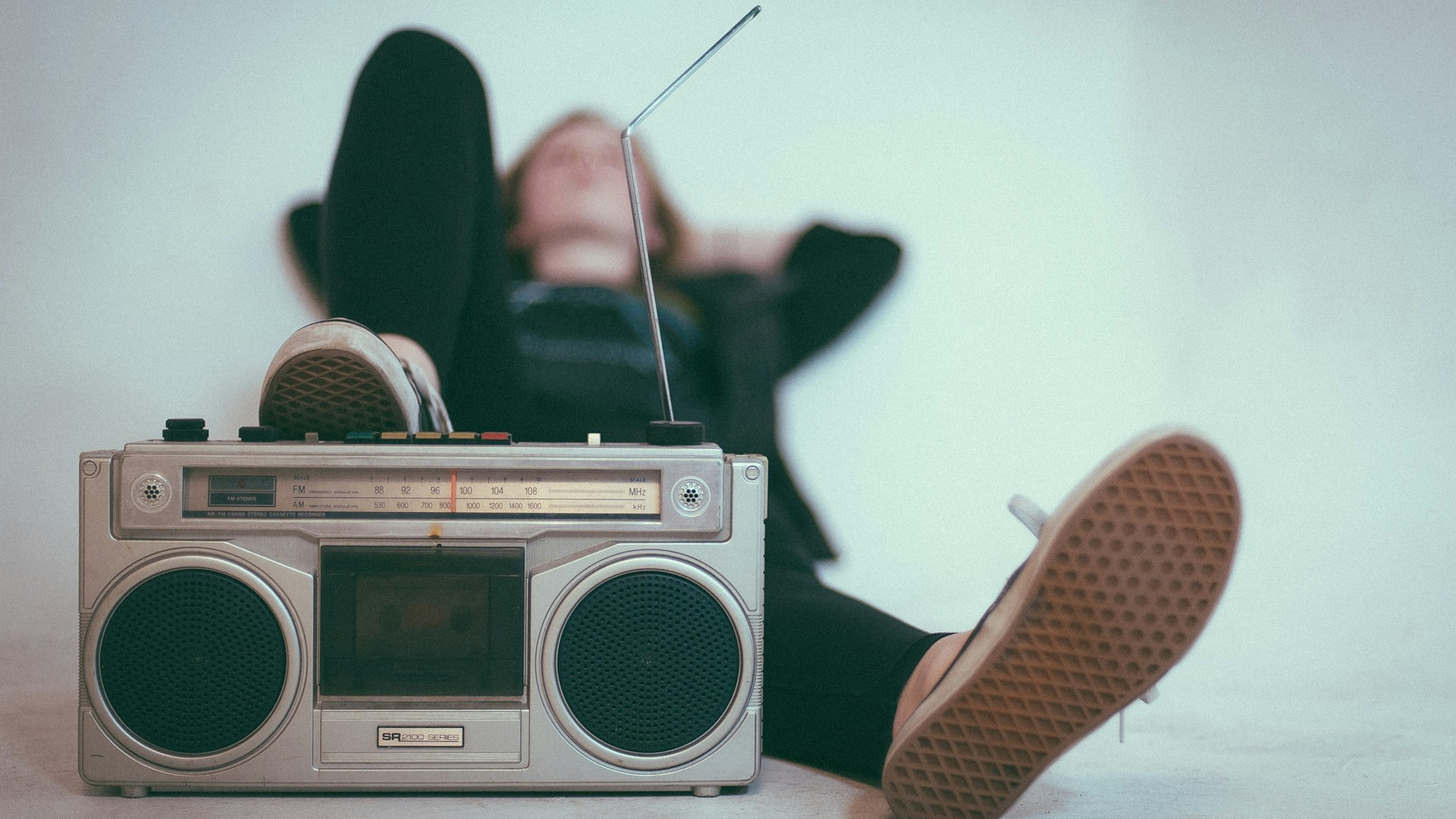 Woman leaning back and listening to the radio