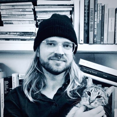 Haakon holding a cat