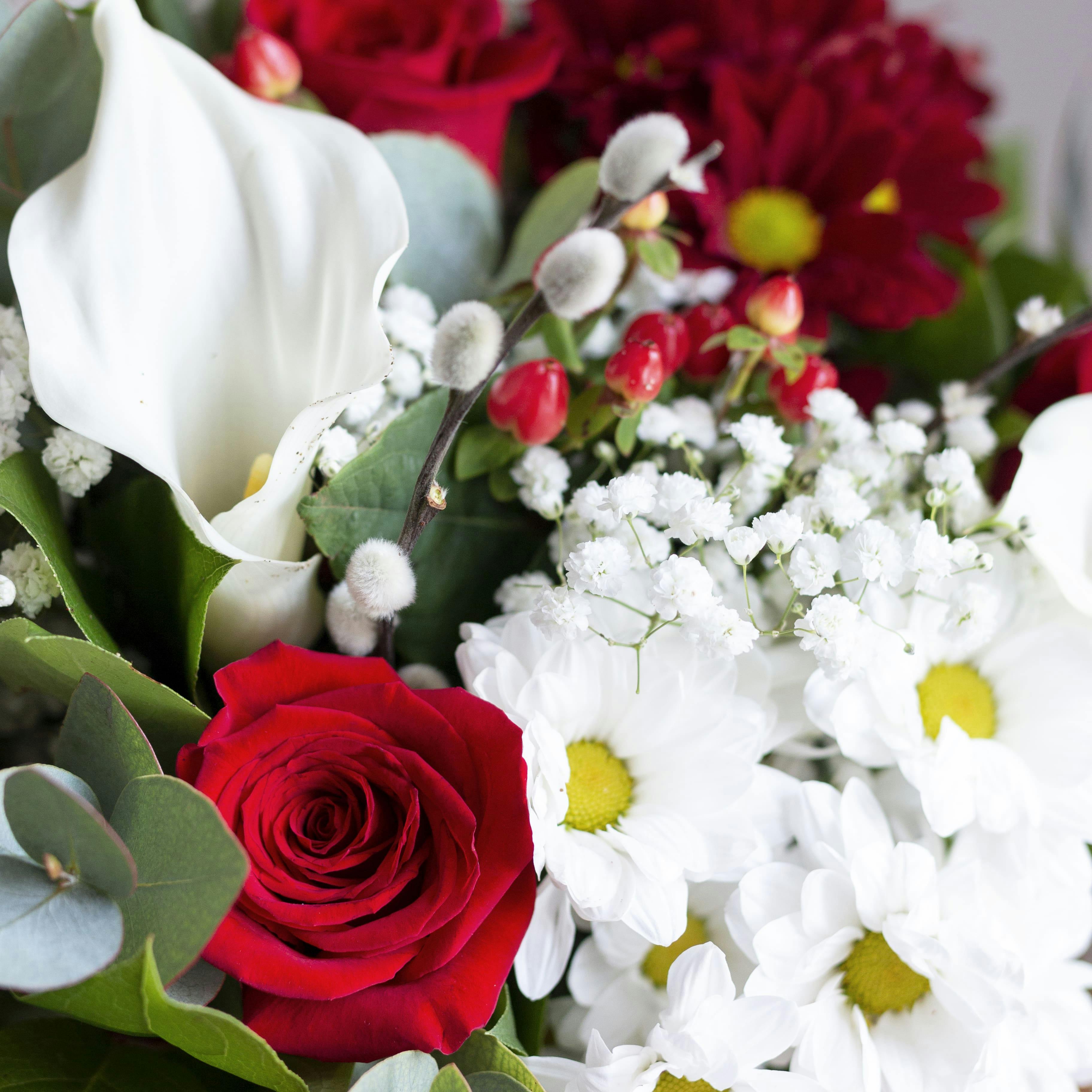 closeup of callas chrysanthemums and roses