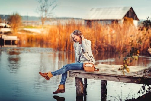 woman outdoors on pier autumn