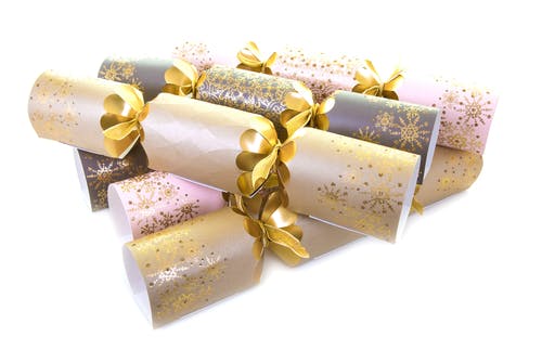 Christmas Crackers wrapped with gold ribbon