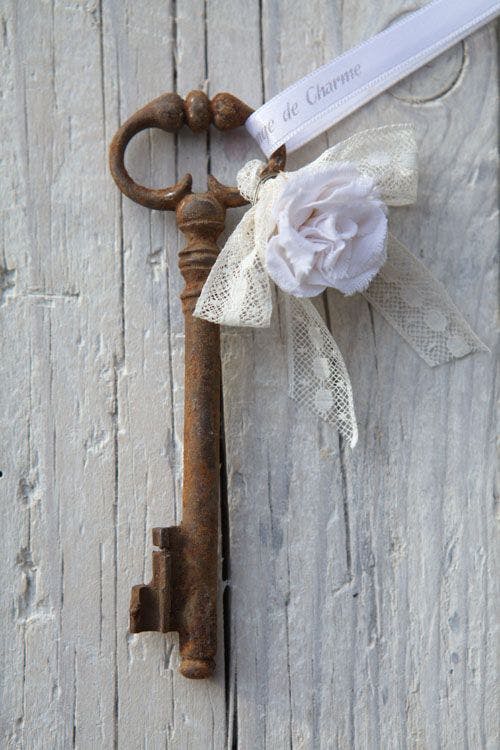 old key with flower and ribbon