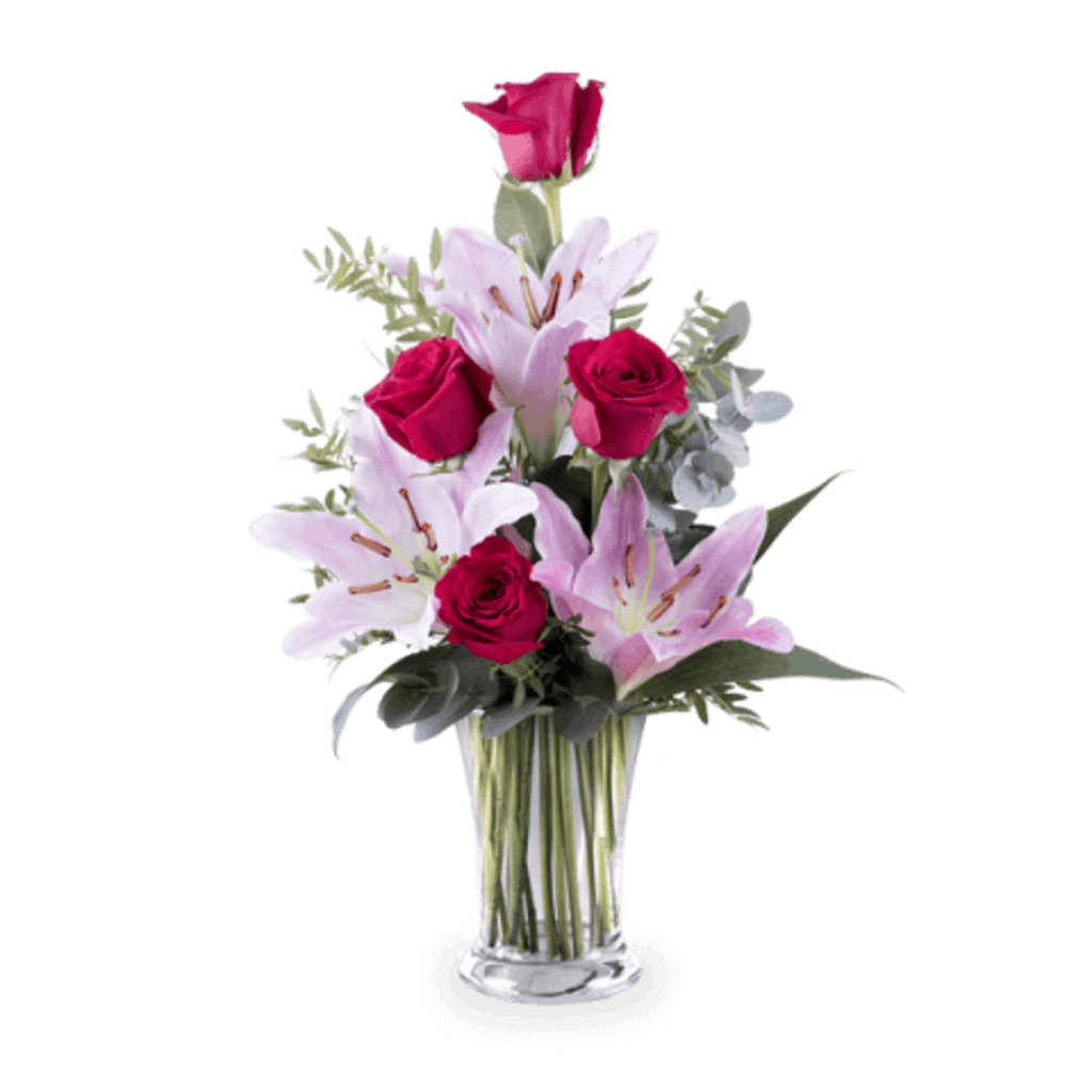 Pink lilies and red roses in a glass vase