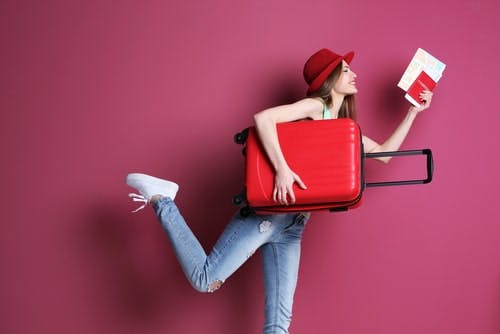 girl running with suitcase and passport