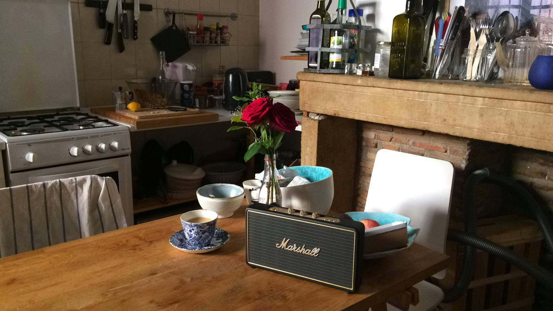 trio of red roses on a table