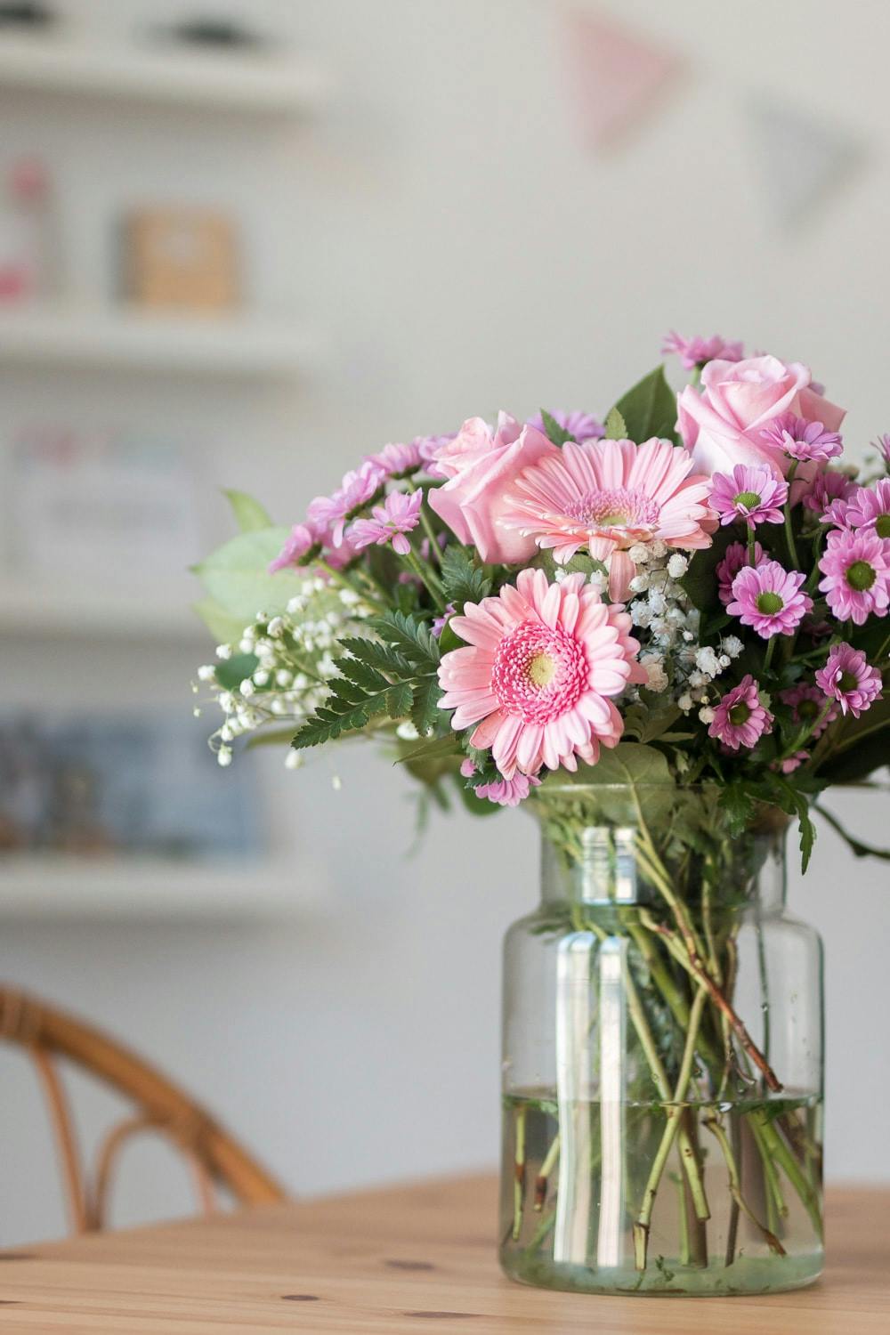 Bouquet of pink roses and gerberas on table