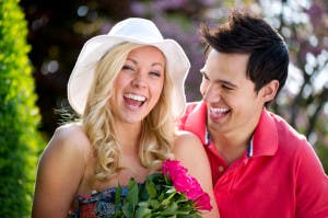 happy-couple-outdoors-with-flowers