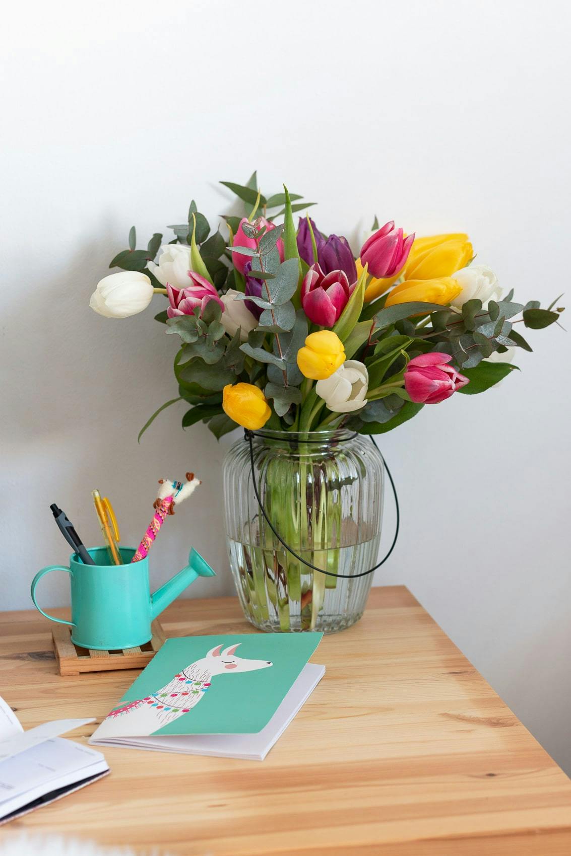 mixed tulip bouquet in glass vase