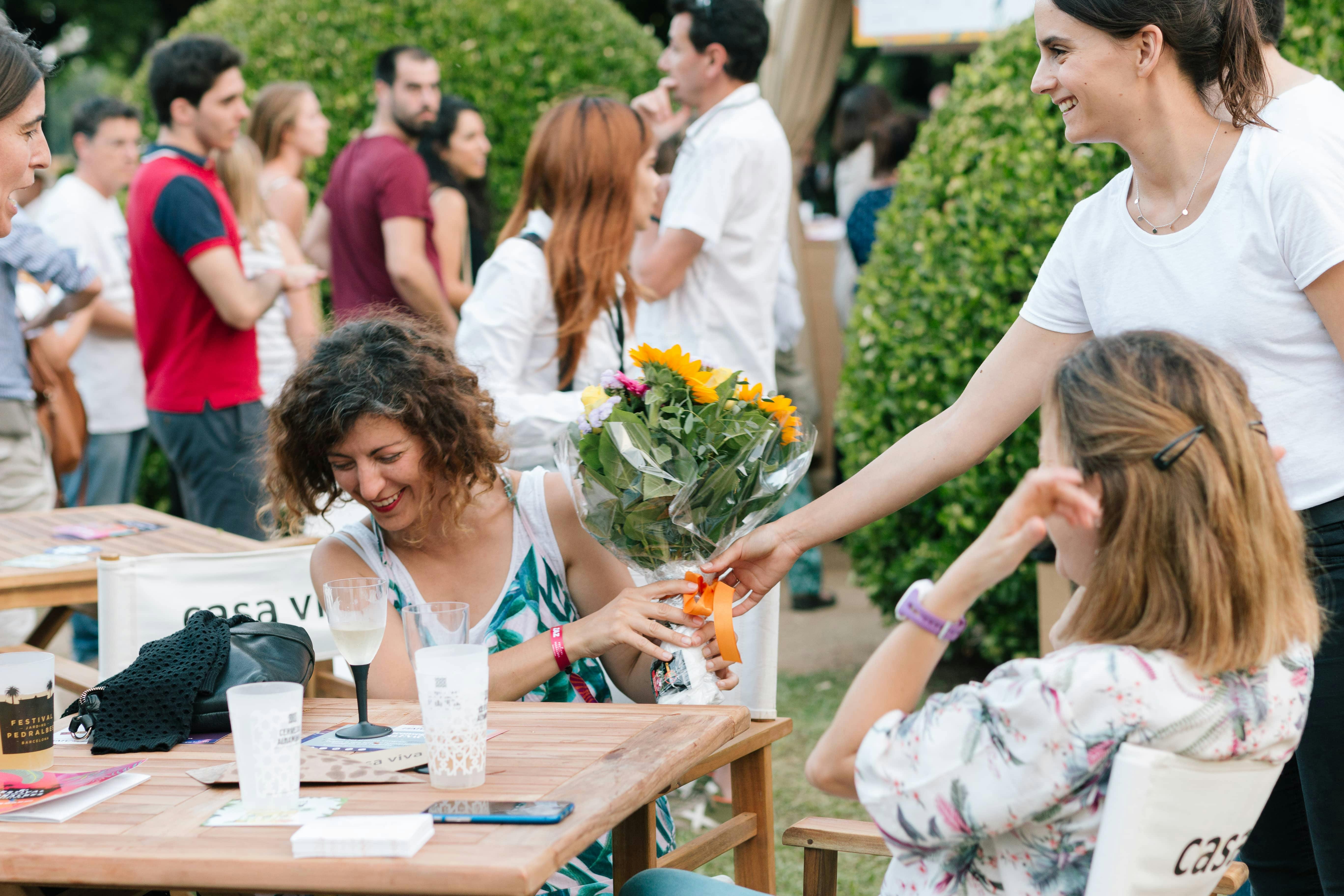 Happy Woman receiving FloraQueen bouquet