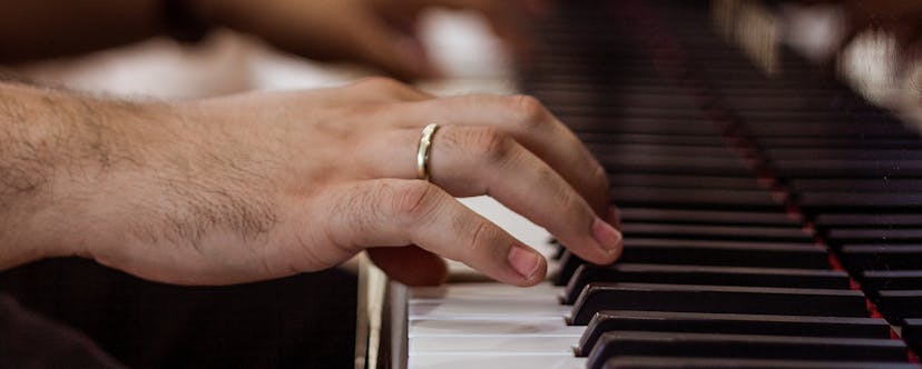 Hand with ring on a Piano