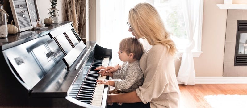 Piano teacher and small child