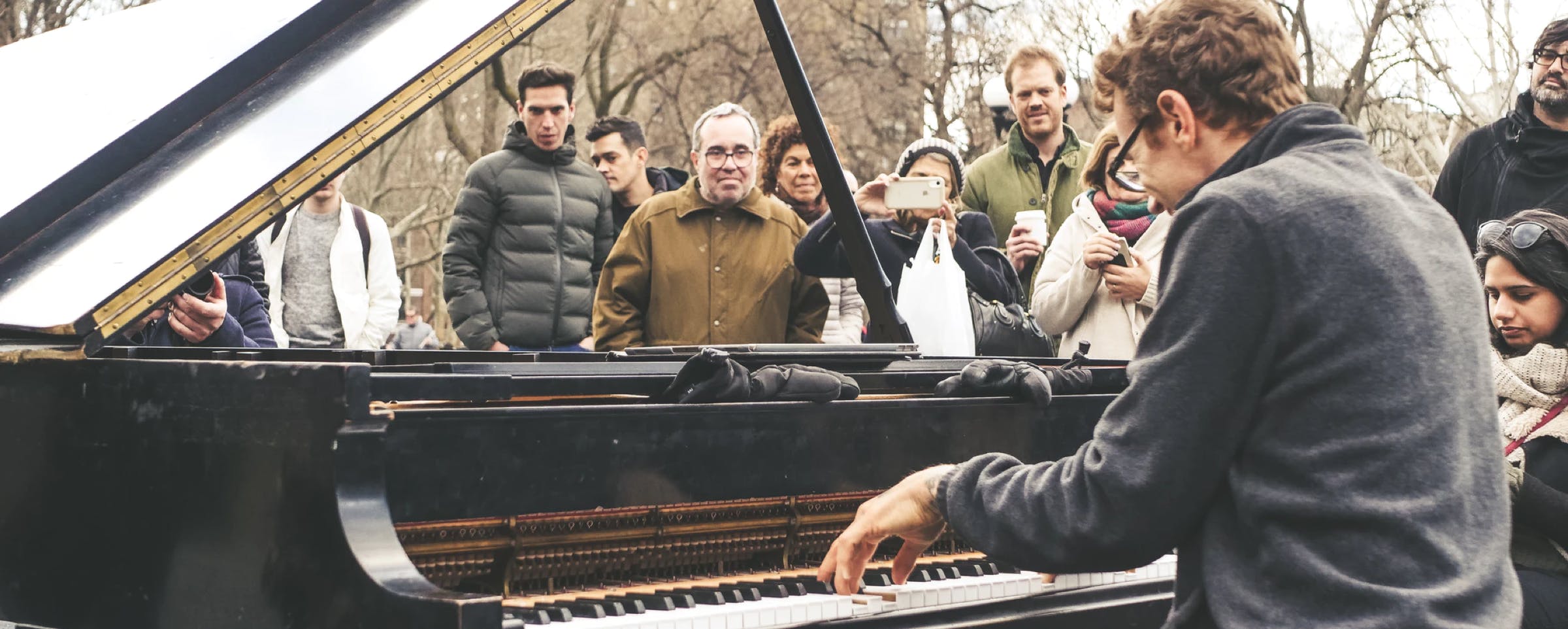 Man playing piano outside