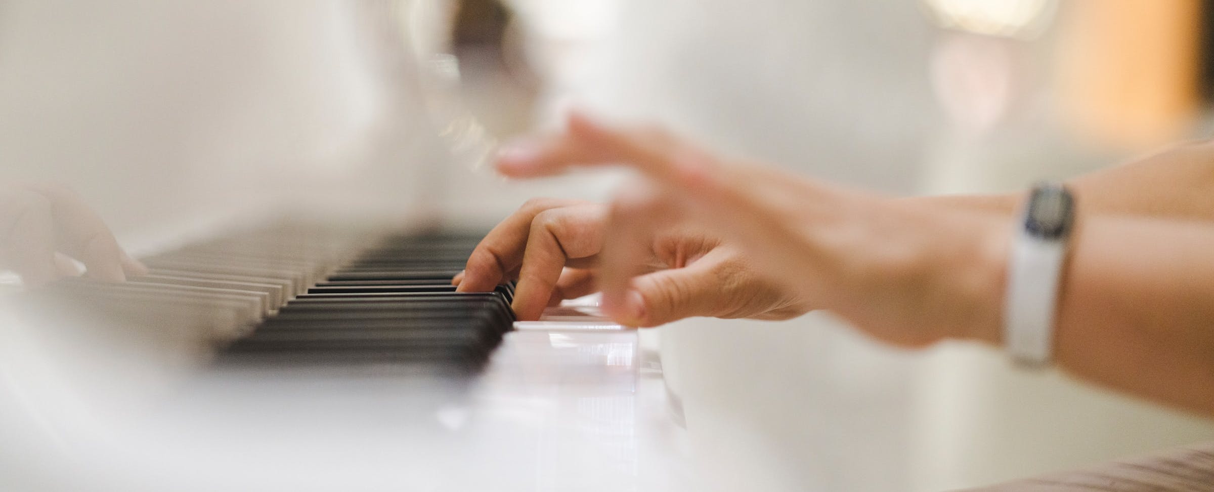 Playing on white piano