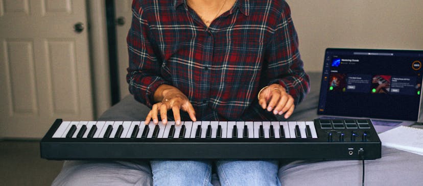Man playing chords on a keyboard
