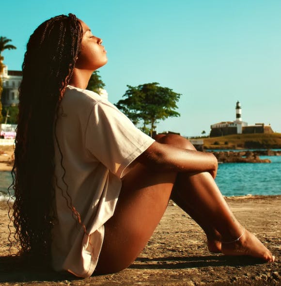 A woman on the beach soaking up the sun