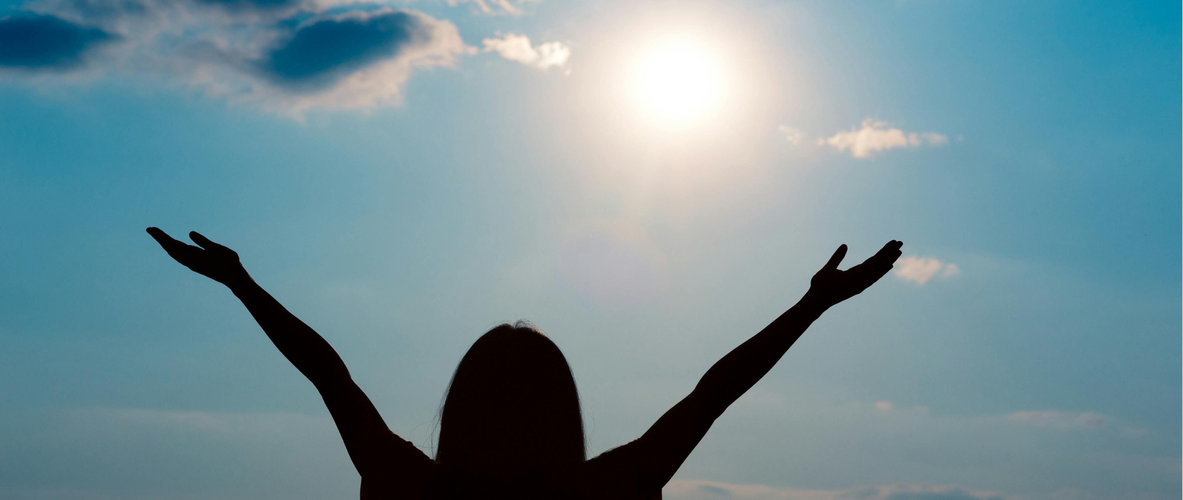 Excited woman enjoying wonderful sunlight